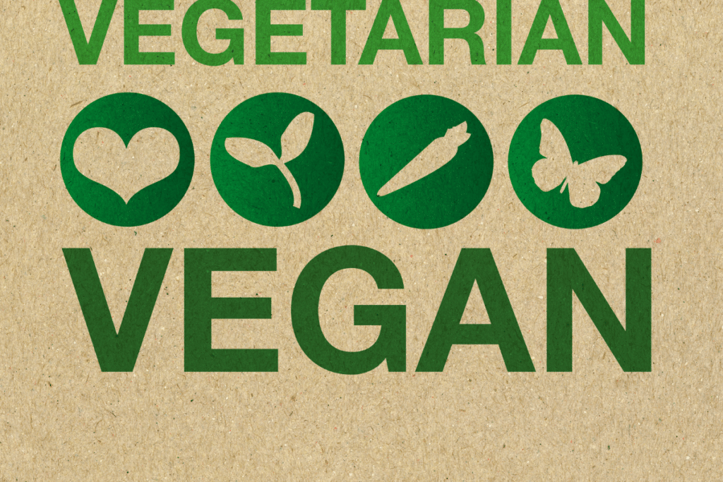 The words vegetarian vegan on a brown paper bag.