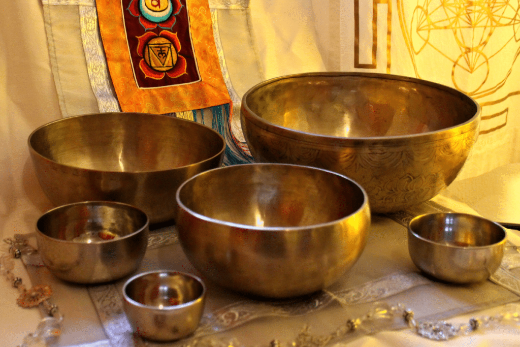 A group of singing bowls on a table.