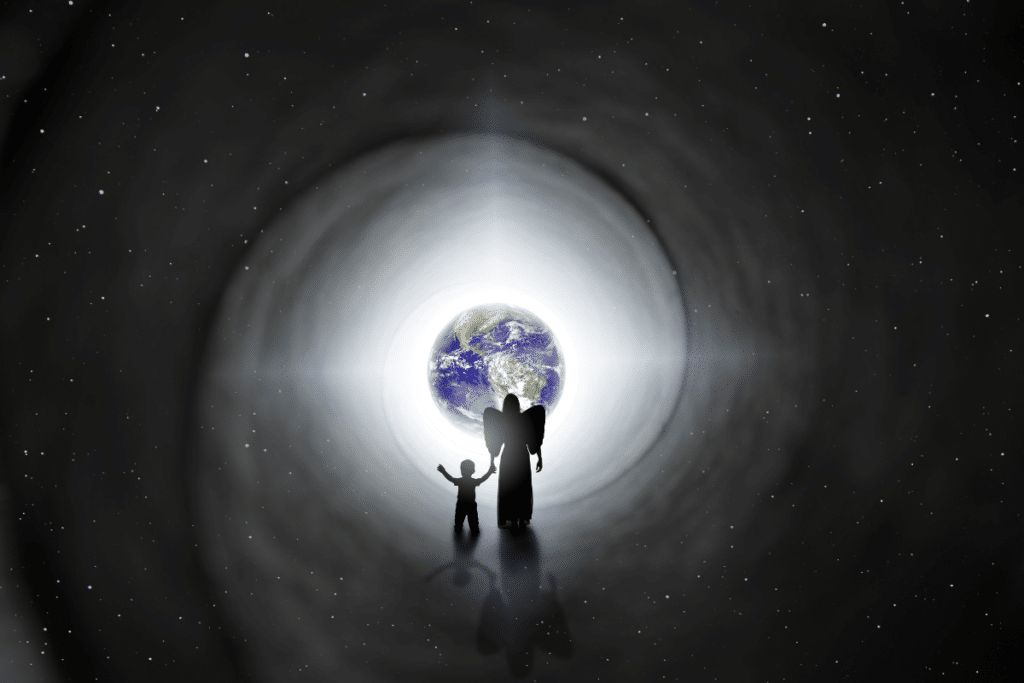 A man and a child standing in front of a black hole.