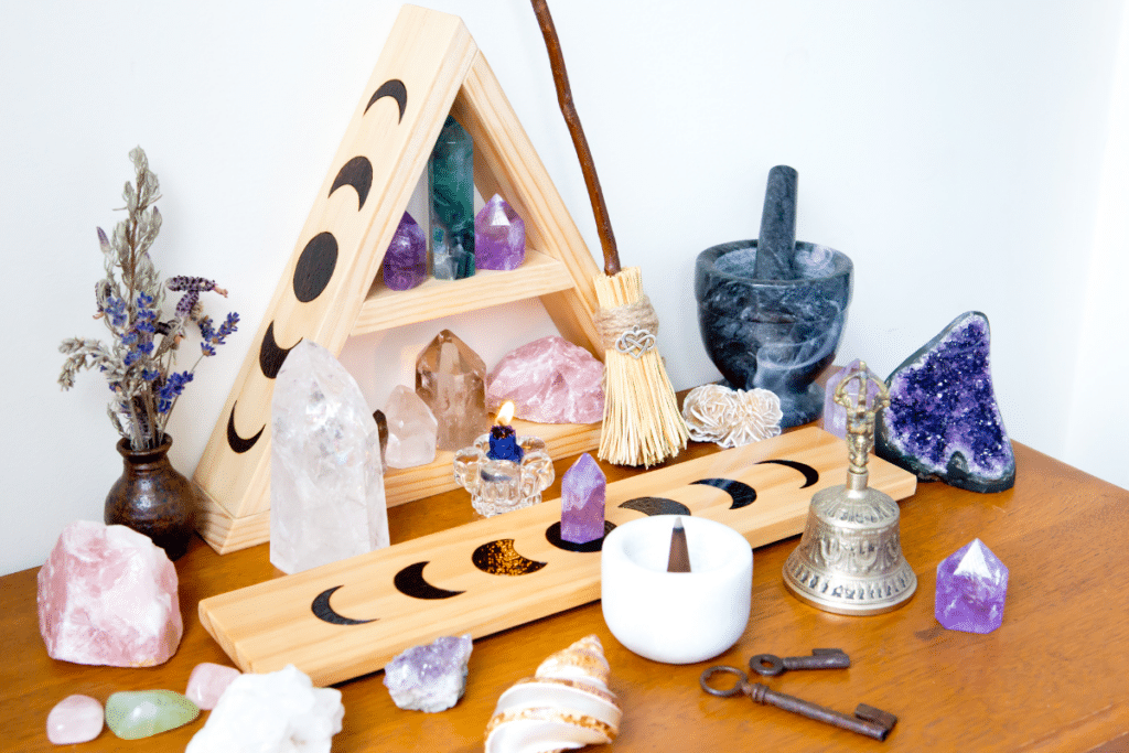 A collection of crystals and stones on a wooden table.